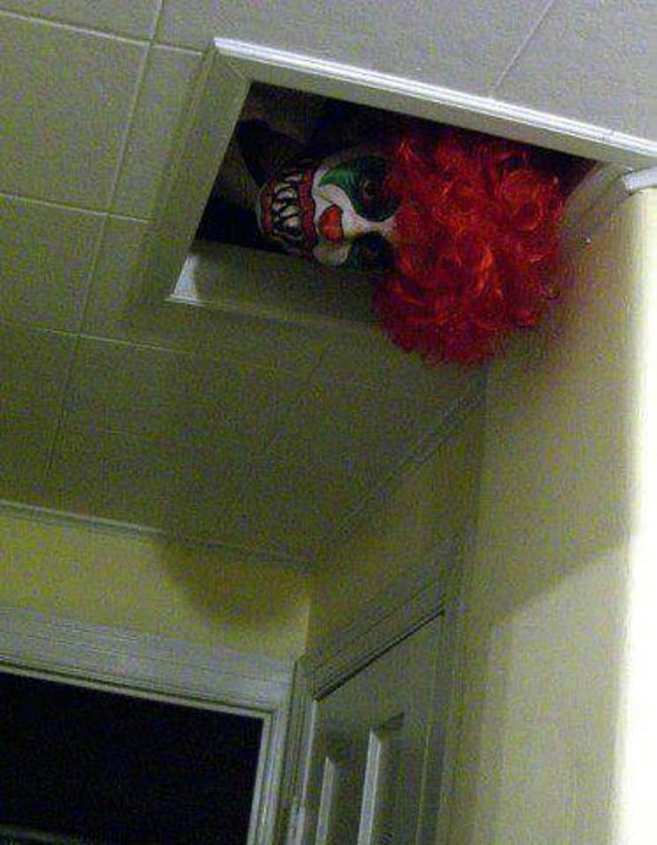 Easily place a clown mask and wig to peek out of the air vent for Halloween bathroom decorations that will scare the crap out of them.