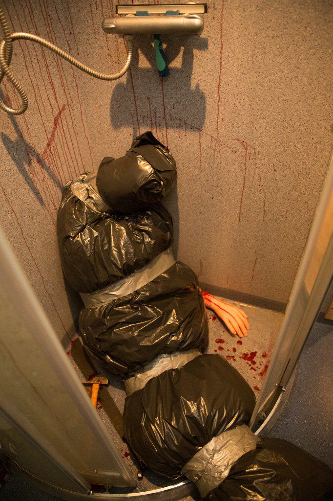 Easy DIY bloody body bag Halloween bathroom decor idea for a small shower