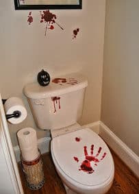 Make them pee a little faster with these easy Bloody Toilet hand prints and Halloween Bathroom Decor