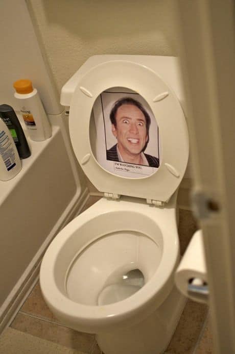 Easy DIY Halloween Bathroom Decorations for the toilet tape a Nicholas Cage picture under your toilet lid to watch you while doing your business