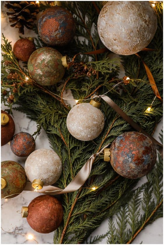 Rusty textured painted ornaments in earthy tones