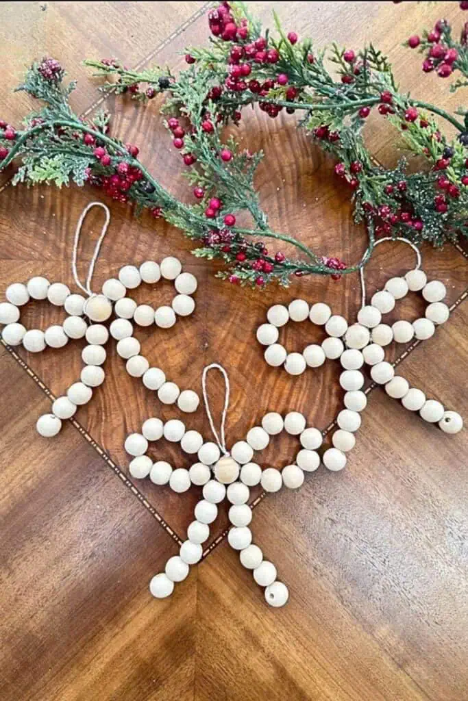These rustic wood bead bow ornaments are an easy and festive DIY Christmas craft to make or sell, perfect for farmhouse-style holiday décor.