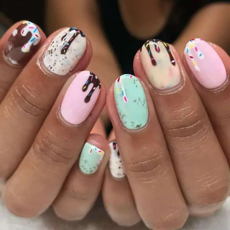 ice cream nail art with sprinkles and chocolate drips 