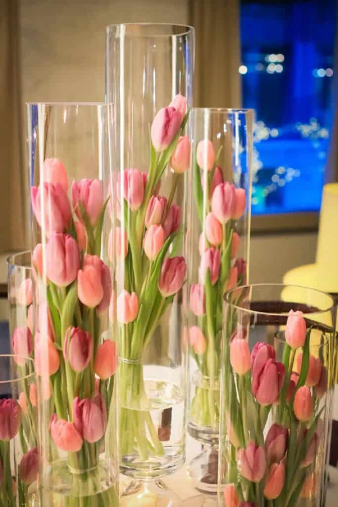 Easter decor ideas for the table dollar tree tulips vases. Simple idea for a Easter dinner centerpiece.