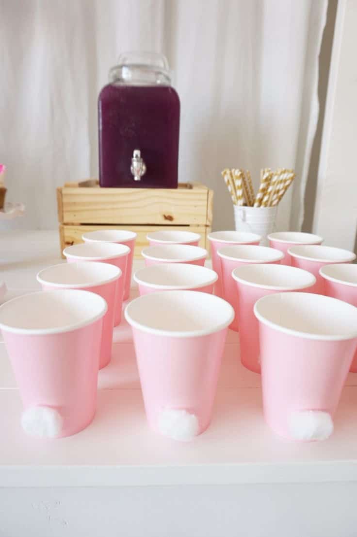 Pink paper cups with little cotton balls glued on to look like a bunny tail