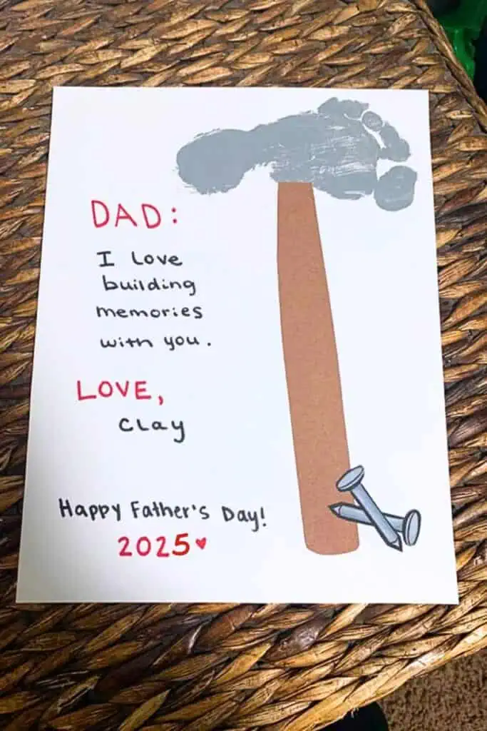 Father's Day Foot Print card with the foot print in grey as the Hammer with a sentimental message to Dad from a baby or toddler