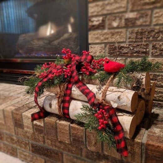 Rustic red Christmas decor ideas for birch wood logs by the fireplace