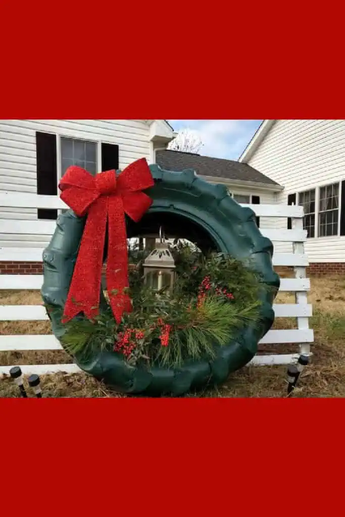 Tire upcycled into a wreath Christmas decoration for the front yard