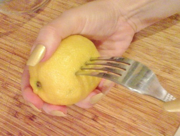 Prick lemon with a fork and place it inside of chicken before roasting for a moist bird. Easy 5 ingredient healthy chicken recipe everyone should have. Fits every diet from keto to low carb or paleo. #dinner