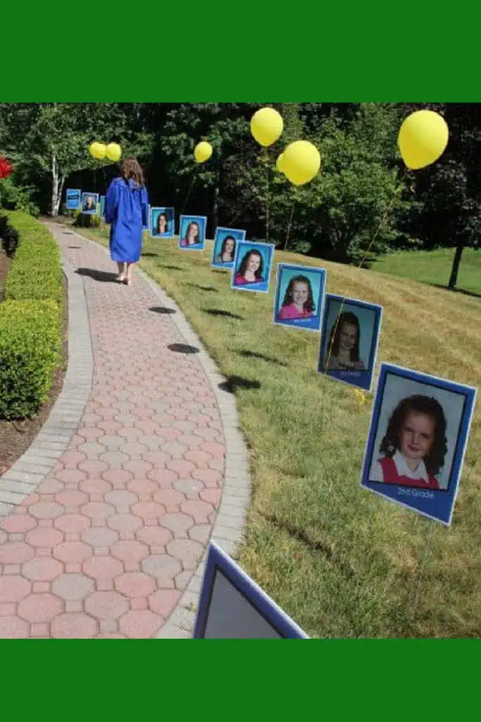 Backyard Graduation Party Photo display along walk way of year book photos