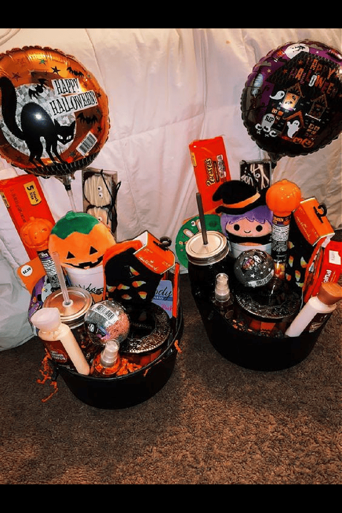 Black Halloween Boo Baskets with balloons, plush toys, scented bath products, and candy