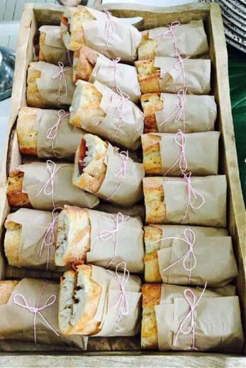 French bread sandwiches wrapped in parchment paper for Graduation Party Food