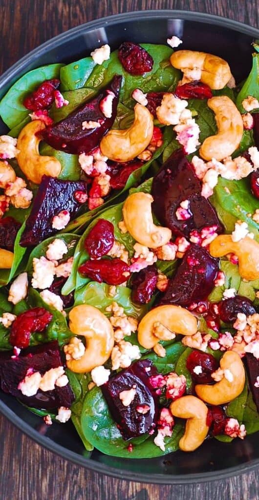 Easy Beet Spinach Salad with Cranberries Cashews and Goat Cheese Appetizer for Holiday Parties and Gatherings