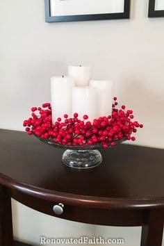 Simple red berries and and candles Christmas decorative tray idea