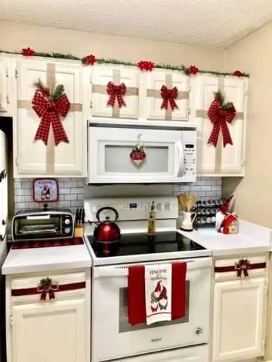 Gift bows tied on kitchen cabinet doors for easy Christmas decorations