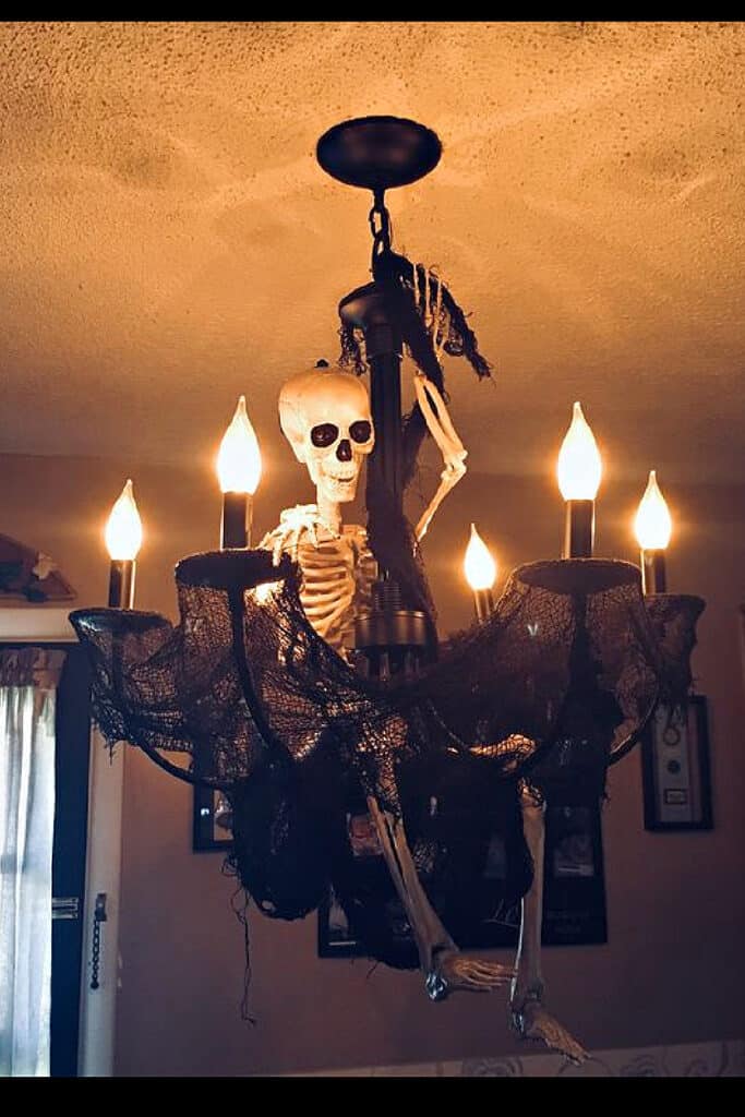 Diy Halloween Decorations using Skeleton for the Chandelier in the home