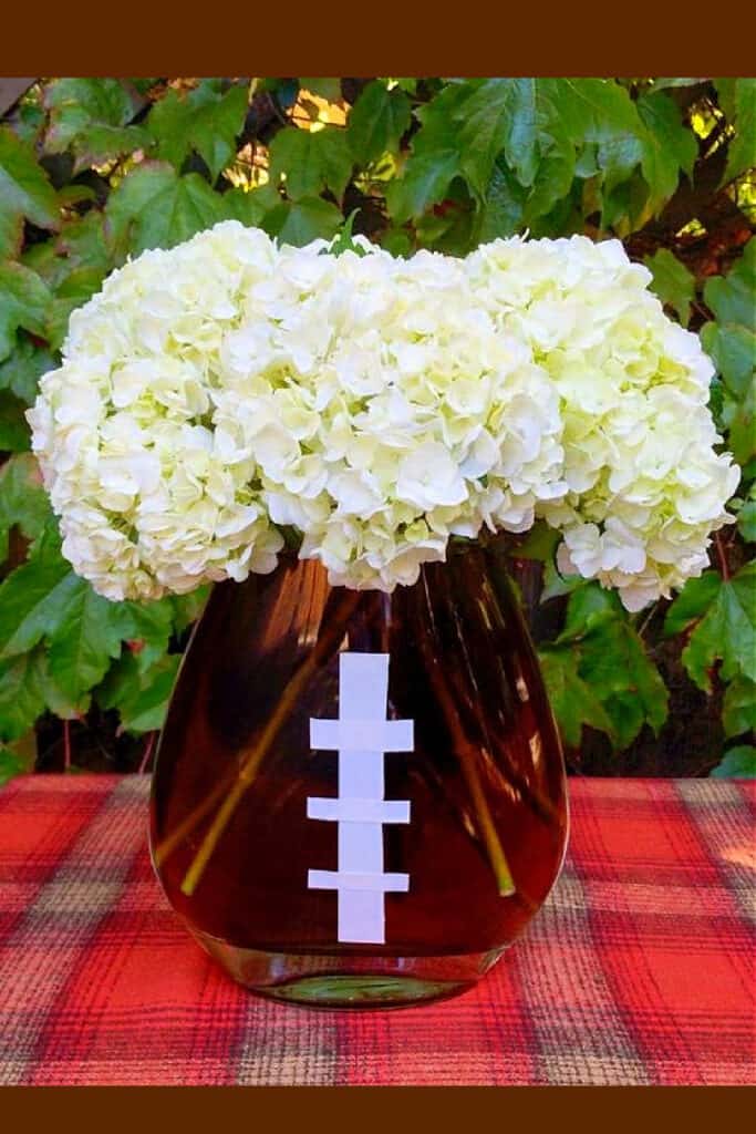 Easy DIY Graduation party Ideas for boys FootBall Centerpiece made from brown food coloring masking tape and a vase