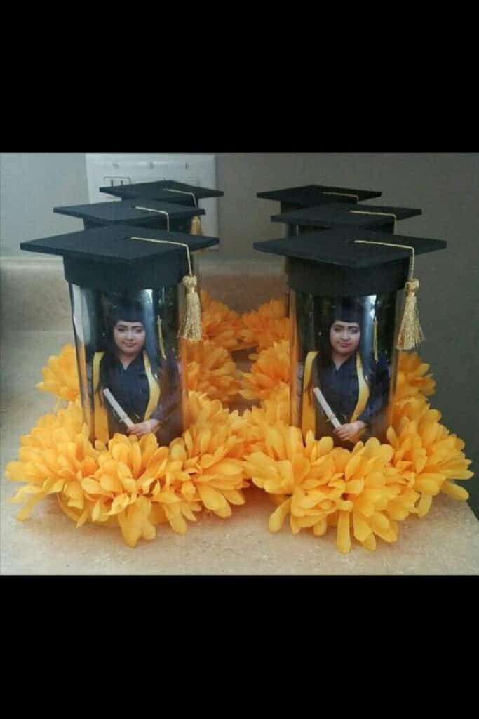 Graduation Party Picture centerpieces with a black cap and gold flowers