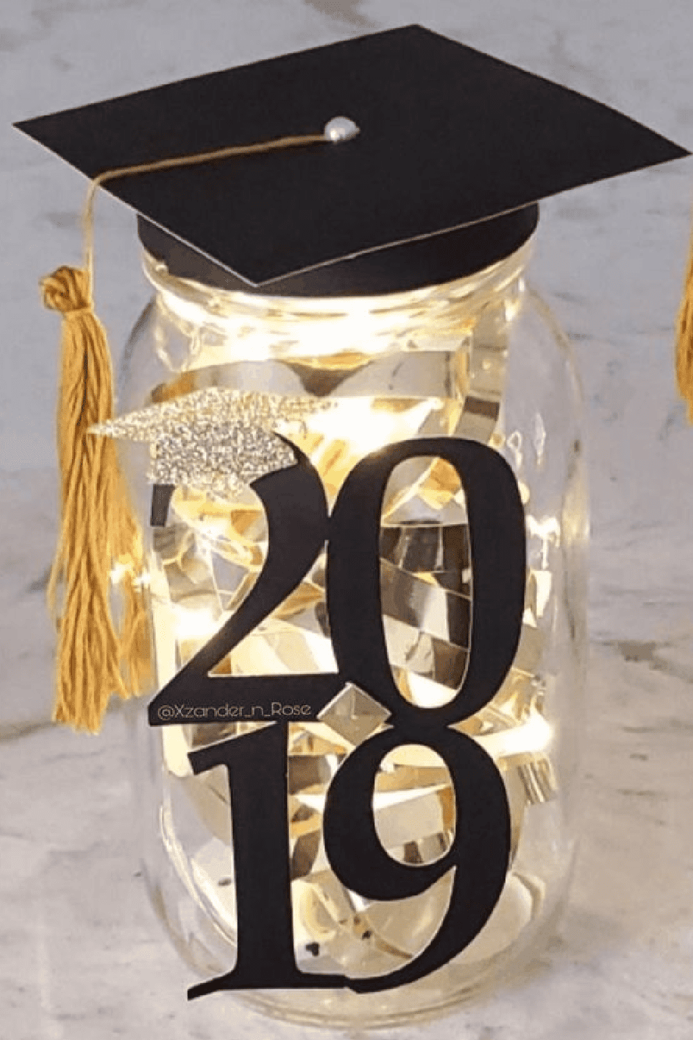 Diy Graduation party mason jar centerpiece with graduation cap lid and led lights inside