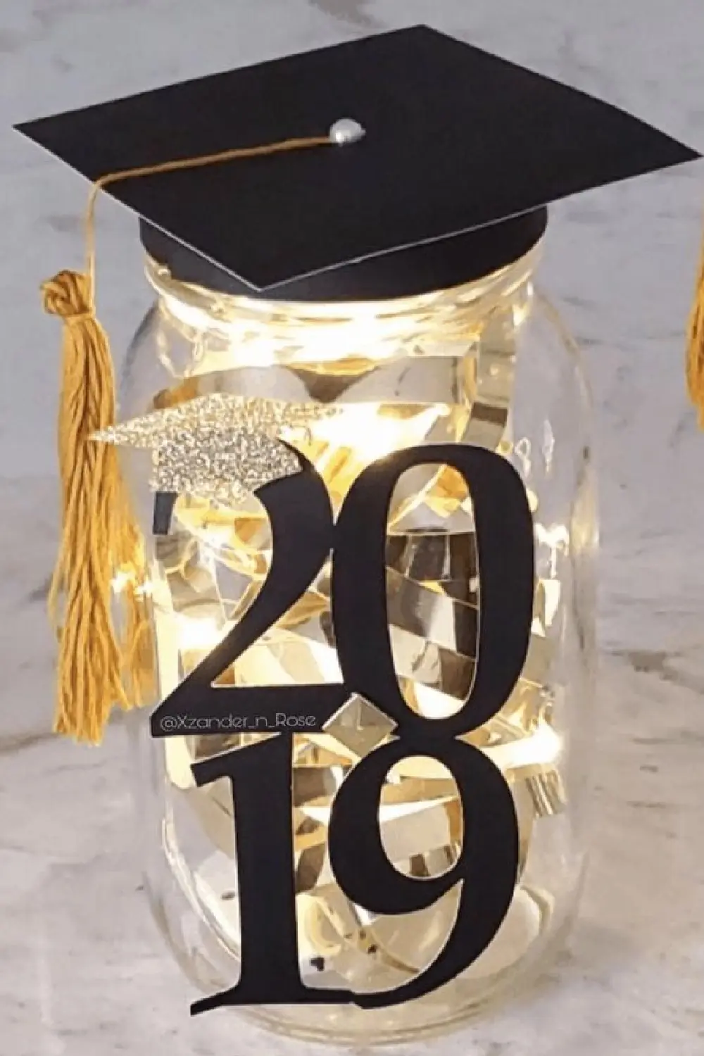 Diy Graduation party mason jar centerpiece with graduation cap lid and led lights inside