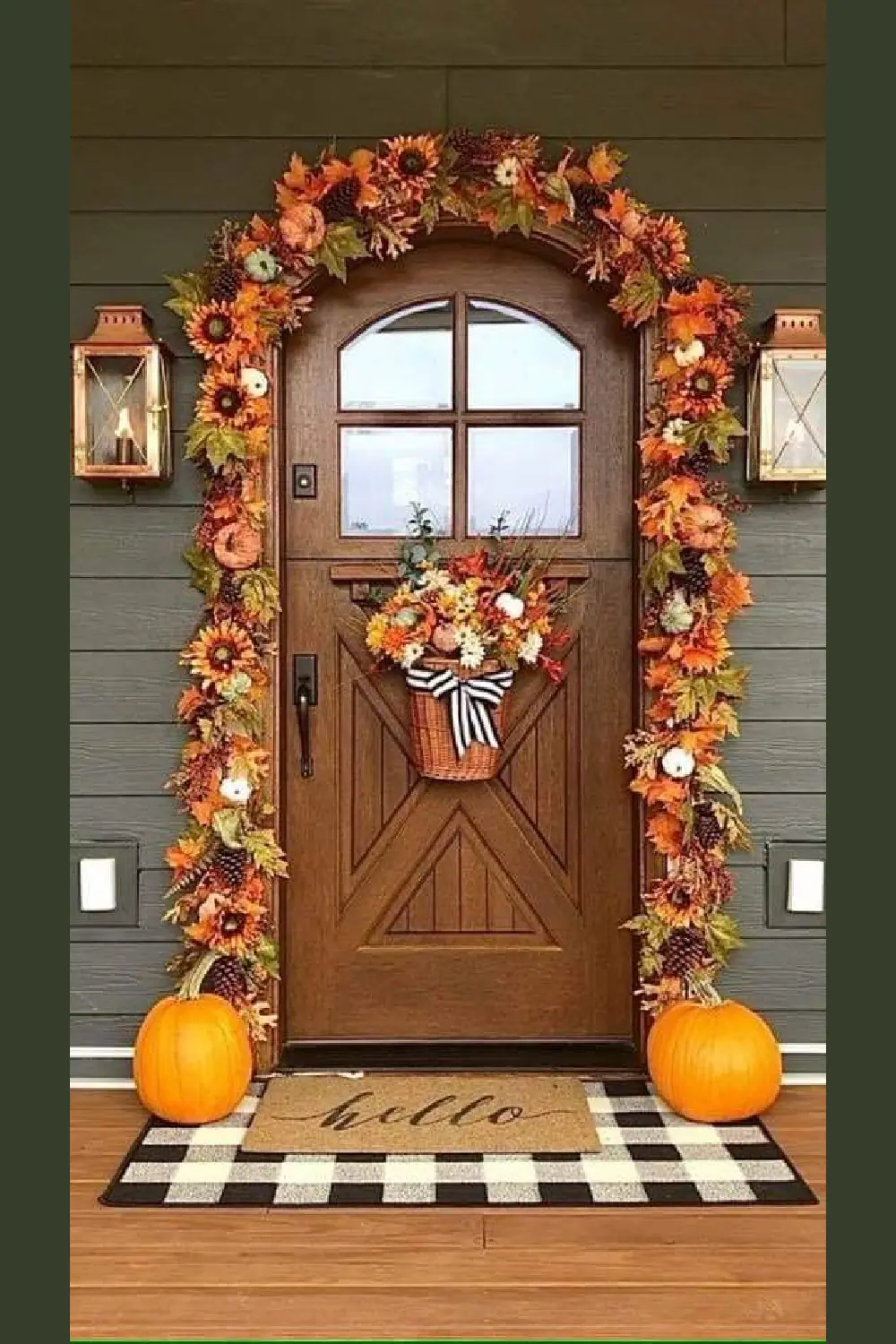 Simple fall decorations for the front door with orange garland, pumpkins, and a basket wreath.