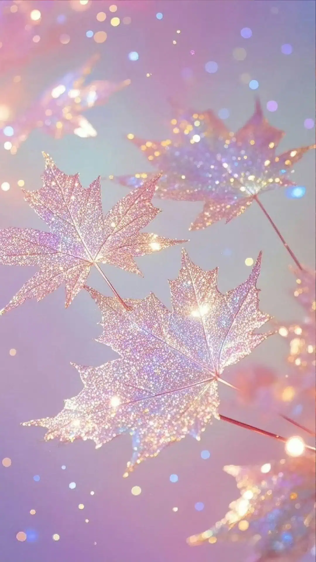 Glitter maple leaves in pastel pink, purple, and gold tones with a dreamy blurred background, styled as a glam fall wallpaper for iPhone.