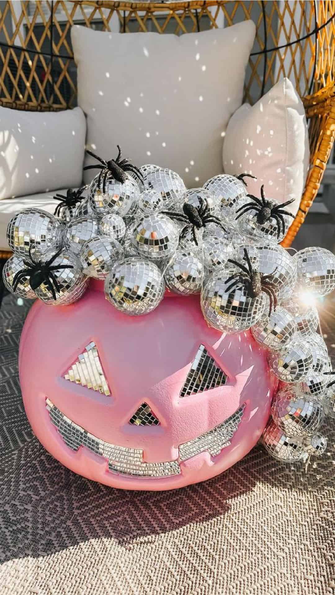 Diy Pink disco ball plastic pumpkin pale Halloween decoration on outdoor porch