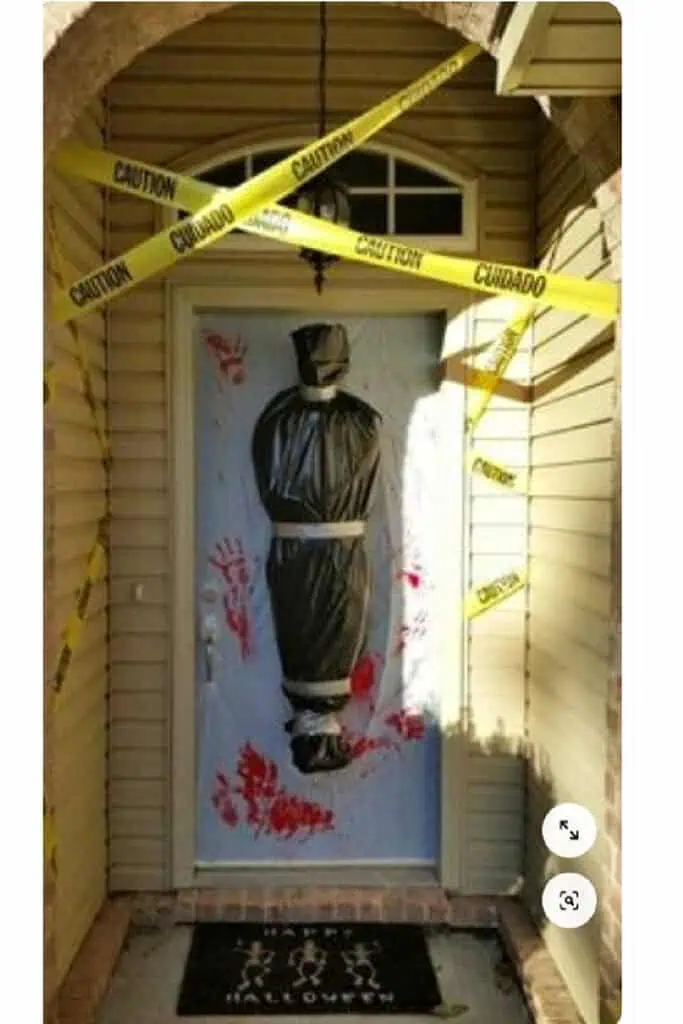 Cheap Easy DIY Halloween Outdoor Decor for the front porch door with a body bag