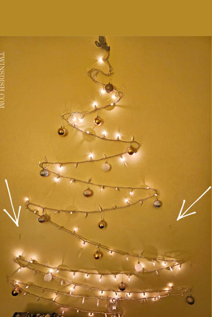 DIY Wall Christmas Tree Decor Idea made with command hooks and string lights