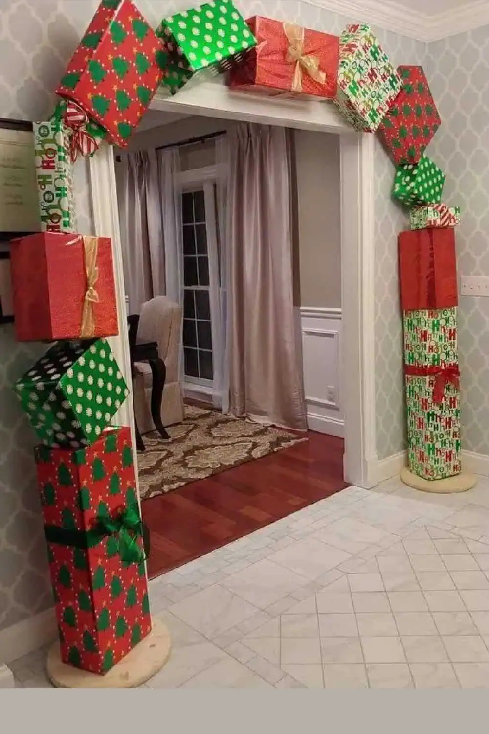 Diy wrapped Christmas Gift box garland over living room entry way