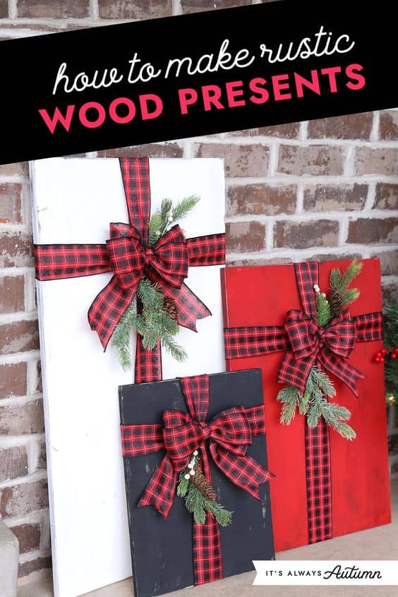 Rustic wood presents Diy Christmas decoration in white red and black wrapped in buffalo check ribbon and a sprig of holly.