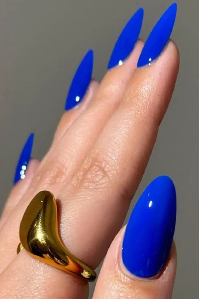 Blue nails in different styles including pastel baby blue, bold navy, royal blue, Manicure ideas for 2025 featuring short square, almond, and long acrylic shapes perfect for end of summer or early fall.