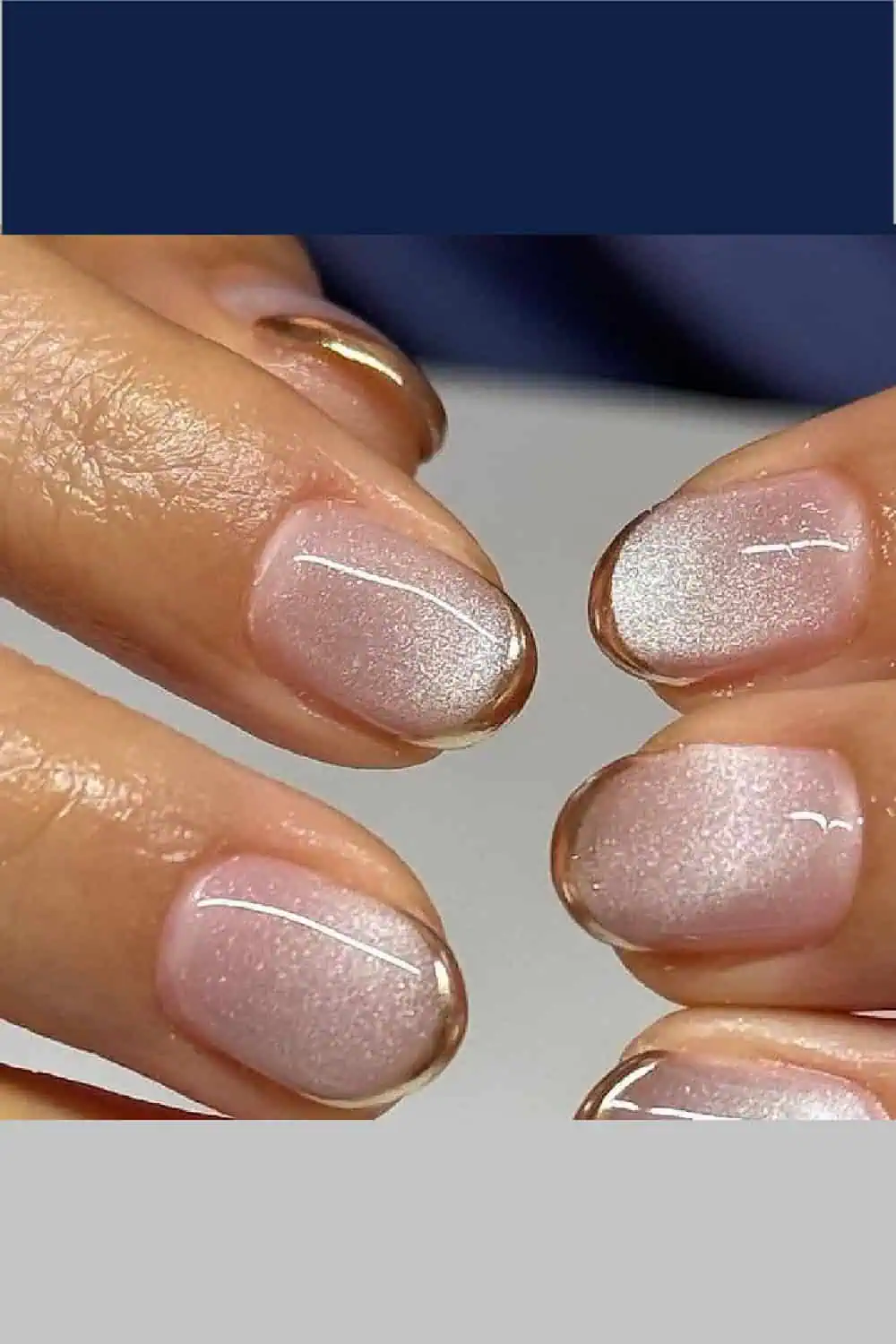 Cat eye fall nails featuring a shimmery magnetic polish effect that shifts in the light with gold metallic french tips. Trendy autumn manicure design with rich seasonal tones, perfect for cozy fall nail art inspiration.