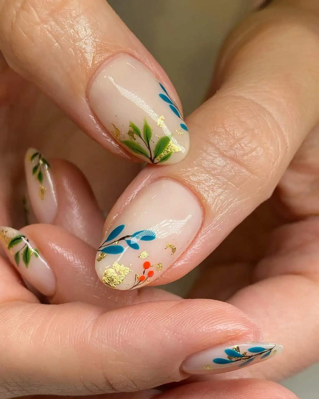 Floral blue, green, orange, and yellow end of summer early fall nails