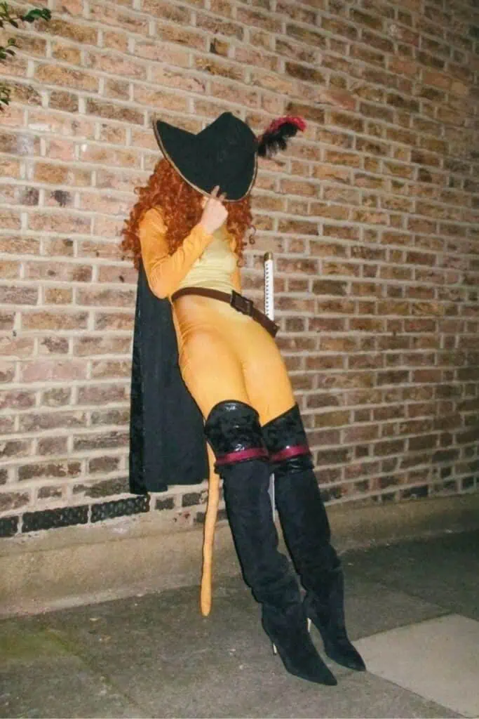DIY Puss in Boots costume for women with thigh high boots, cape, and hat cute Halloween costume idea