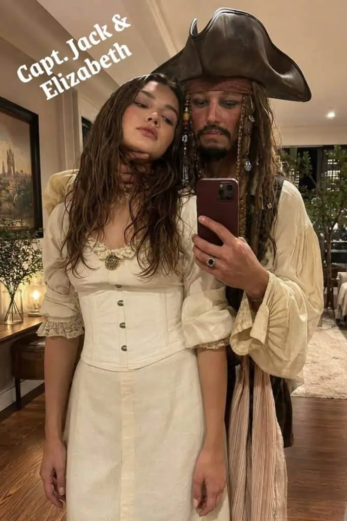 Couple dressed as Jack Sparrow and Elizabeth from Disney’s Pirates of the Caribbean for Halloween.