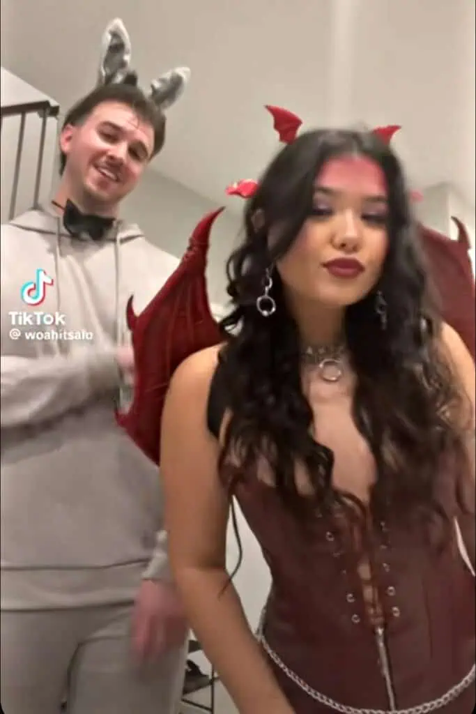 Donkey and Dragon couple Halloween costume inspired by Shrek with donkey ears and bow tie outfit paired with dragon wings, horns, and corset.