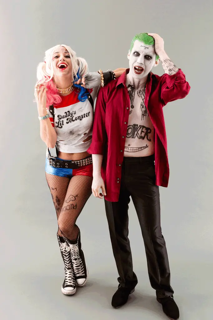 Couple dressed as Joker and Harley Quinn in matching Halloween costumes — fun, iconic, and easy DIY cosplay idea for couples.