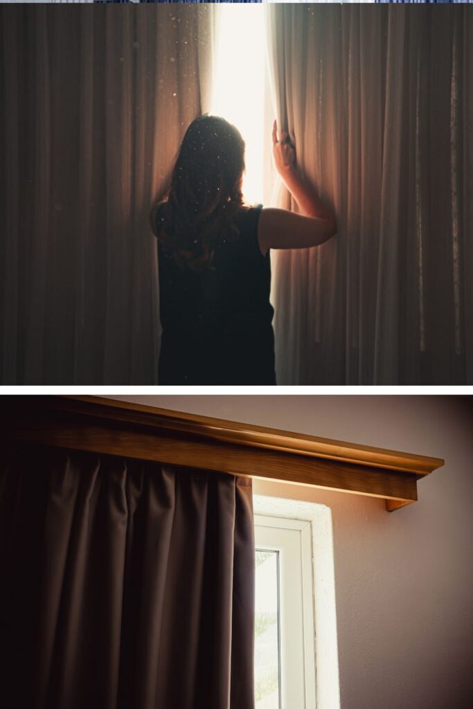 Blackout curtains covering a dorm room window to block sunlight and create a darker, more comfortable college bedroom.