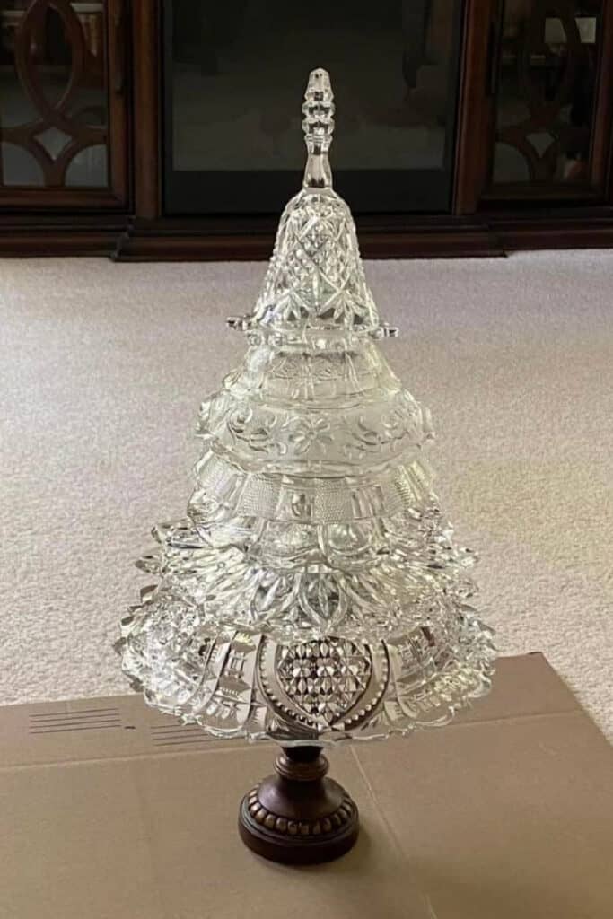 DIY glass bowl Christmas tree made from stacked cut glass bowls and dishes on a pedestal base. Elegant vintage-inspired holiday decoration that sparkles like crystal and creates a luxe look for Christmas 2025.
