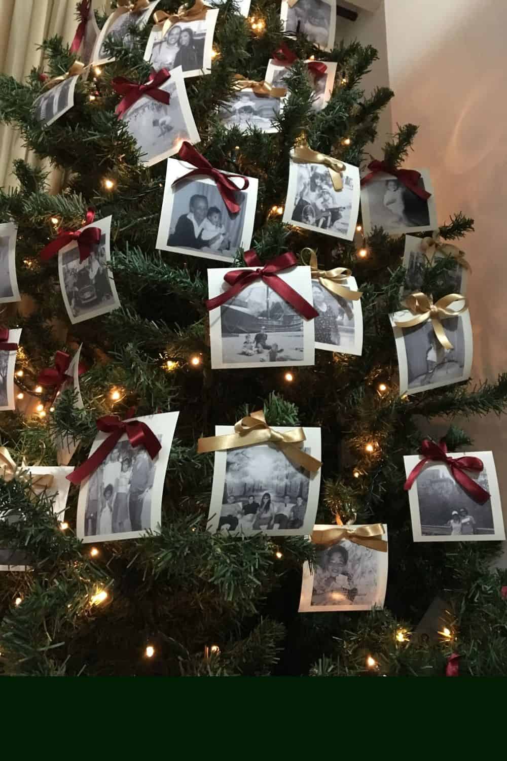 Christmas tree decorated with black-and-white family photograph Diy ornaments tied with red and gold ribbon bows, illuminated by warm white string lights for a personalized, nostalgic, and sentimental holiday display.