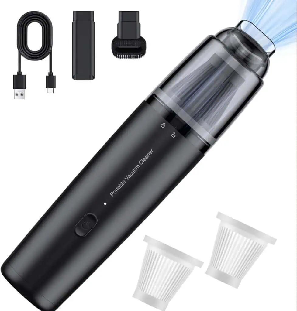 Black portable mini vacuum cleaner for guys dorm rooms – sleek handheld cordless design with transparent dust bin, powerful suction, USB-C charger, brush nozzle for crumbs, crevice tool, and washable filters. Perfect quick-clean gadget for messy college desks, beds & snacks. #DormEssentials