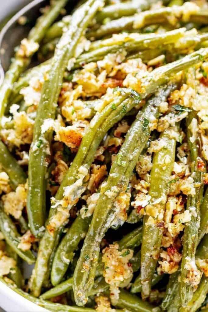 Crispy roasted green beans coated in garlic butter and parmesan, served in a bowl. A quick, 15-minute gourmet Thanksgiving side dish that’s flavorful, easy, and perfect for holiday dinners or Friendsgiving gatherings.