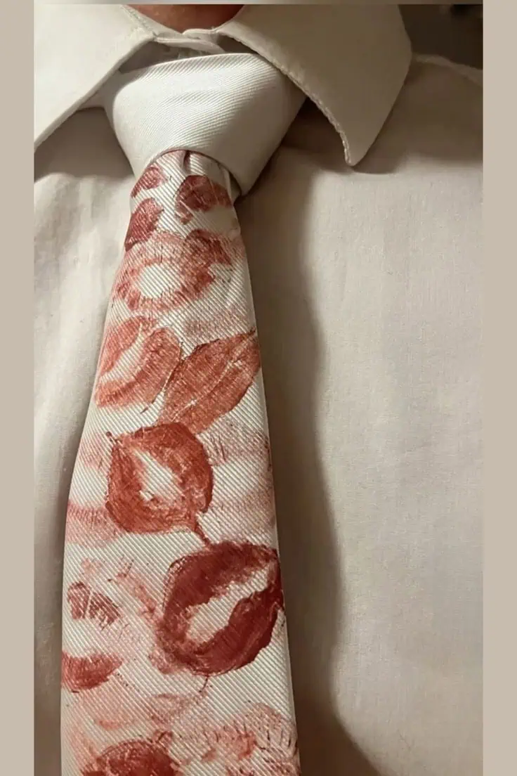 DIY white tie covered in red and pink lipstick kiss prints for a romantic boyfriend gift
