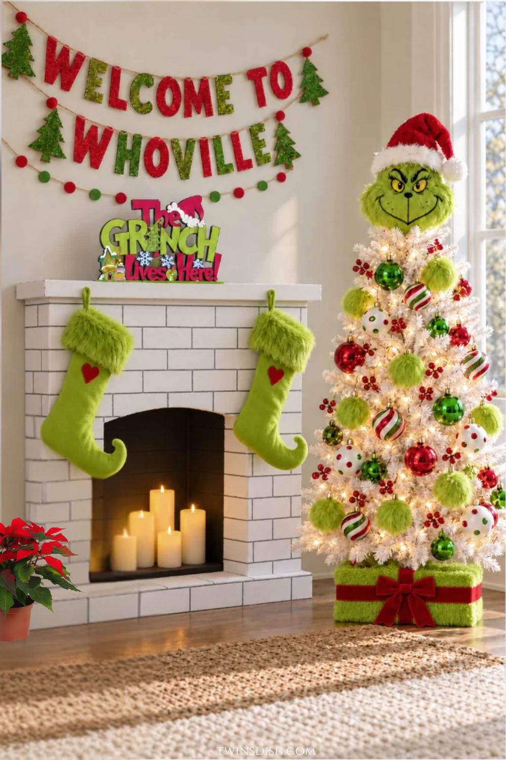 Grinch-themed white Christmas tree decorated with red and green ornaments, fluffy lime-green pom-poms, and a Grinch Santa hat topper beside a DIY faux-brick fireplace with green stockings and Whoville decorations.