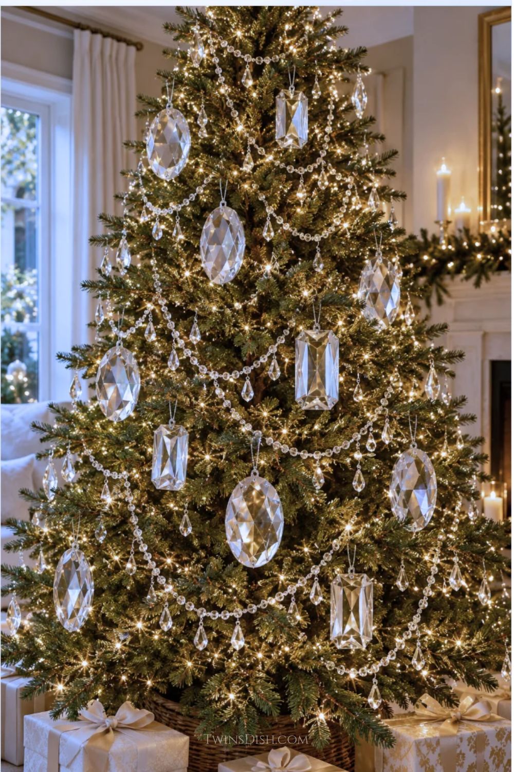 Jeweled Christmas tree decorated with oversized clear gemstone ornaments, crystal bead garland, hanging crystal drops, and warm white lights in an elegant living room.