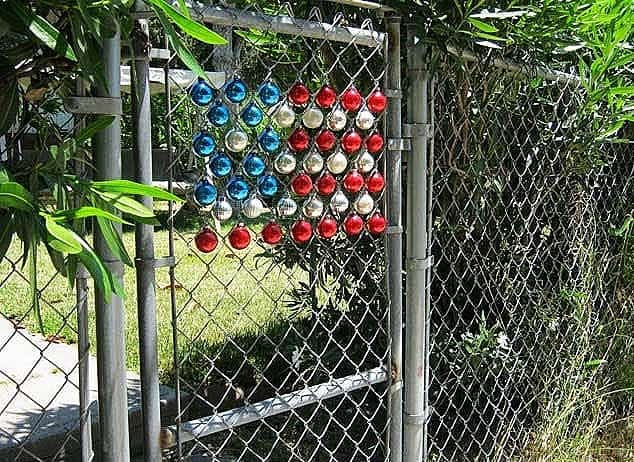 Easy DIY 4th of July gate Decoration idea for your gate using Christmas Ornaments. Easy 4th of July party ideas.