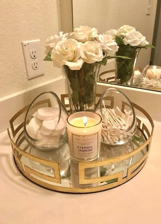 The best easy DIY small Bathroom decor ideas on a budget for apartments using a tray and canisters for storage and organization