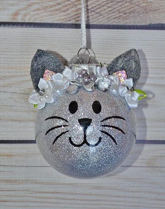 Easy DIY Cat Ornament you can make with a clear glass ornament, acrylic paint, and gel markers or a black sharpie. Great, simple, craft gift for kids, teachers, friends, and Christmas.