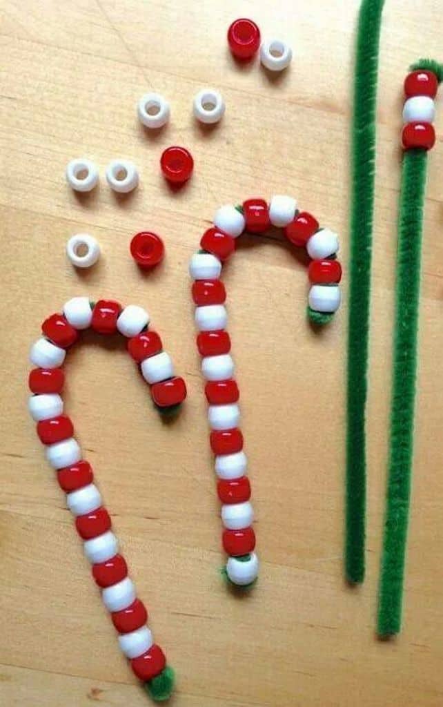 Easy DIY Christmas Ornament Craft kids can make. Cute beaded candy cane for the Christmas tree.